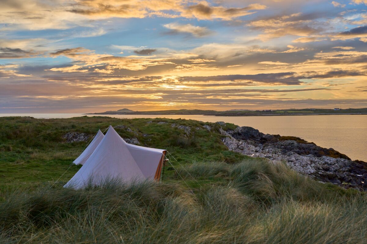 camping in bell tent at sunset